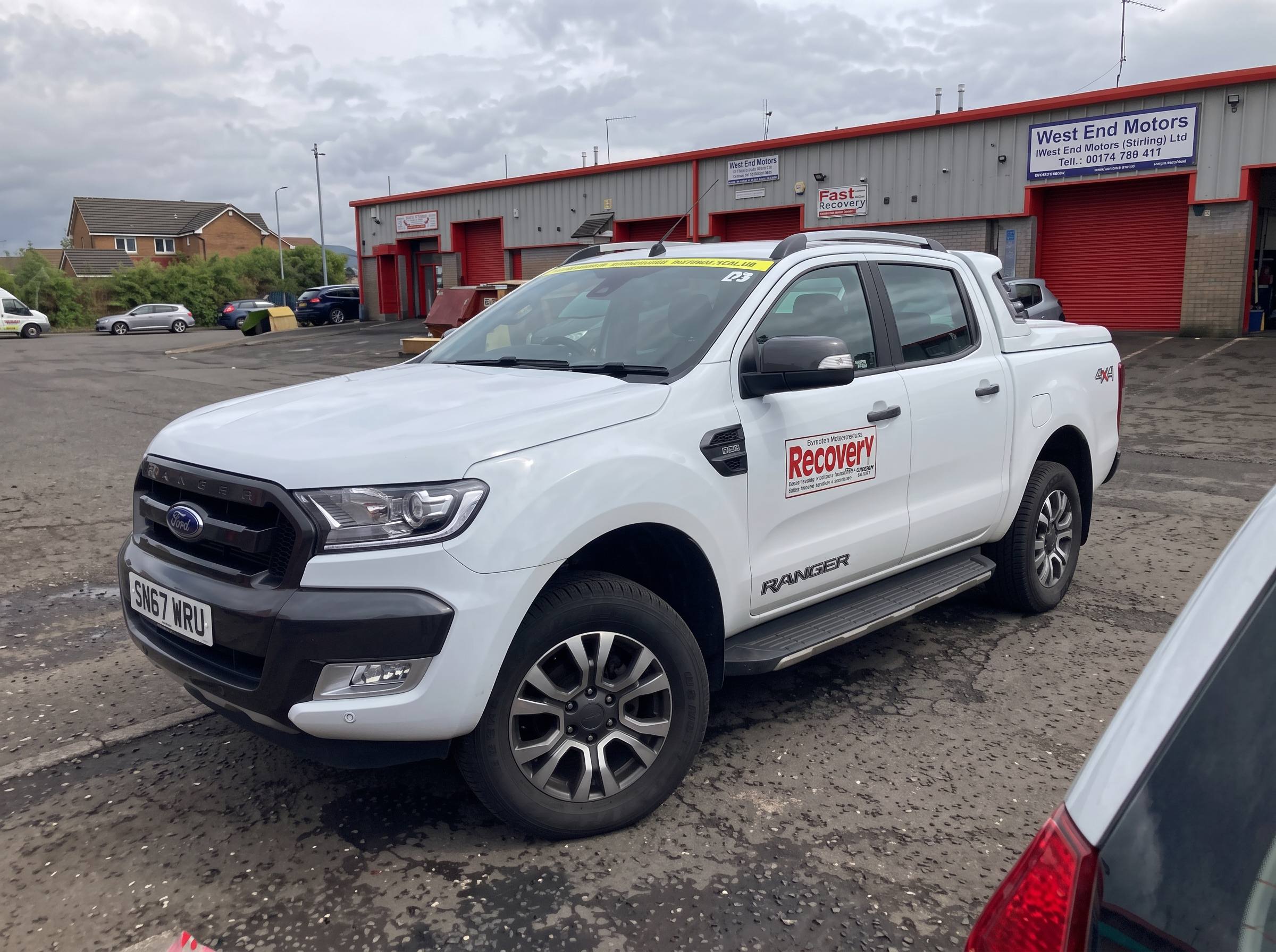 Branded Wright Garage & Recovery pickup truck outside the Port Glasgow garage