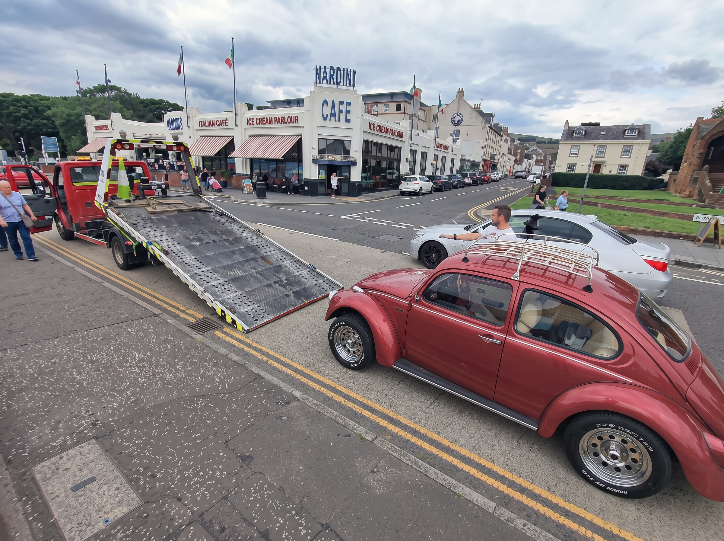 Classic car being loaded onto a Wright Garage & Recovery vehicle transport truck
